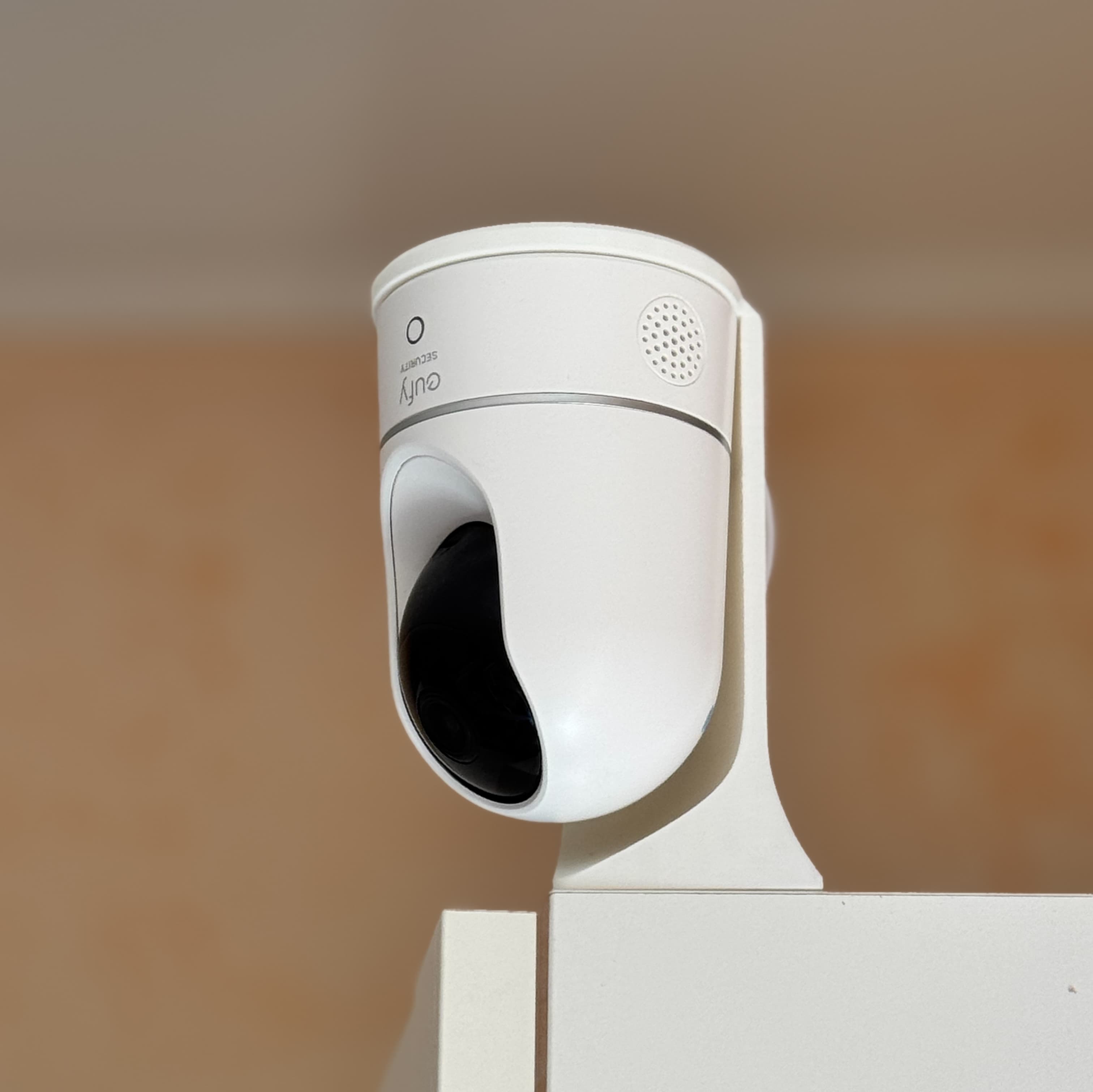 Stand balanced on the corner of a tall cabinet, base removed.